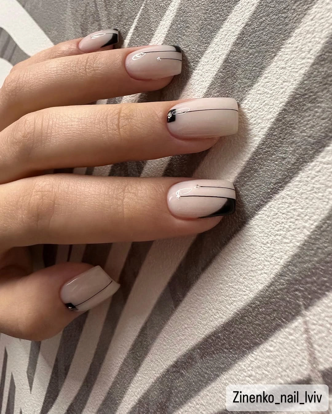 Short square nails in glossy deep navy blue with crisp edges