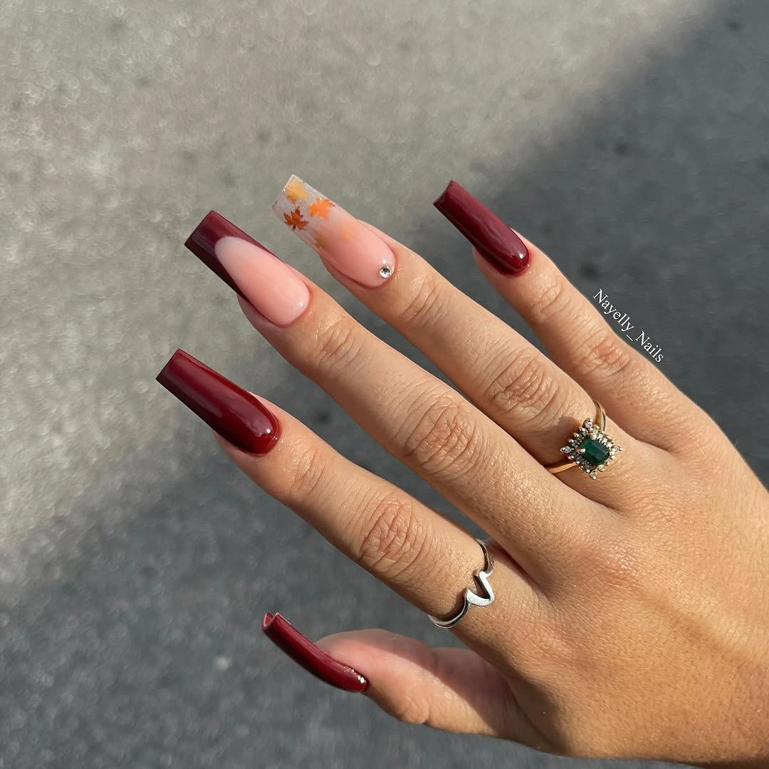 Burgundy square nails with striped tips and warm fall color blocks
