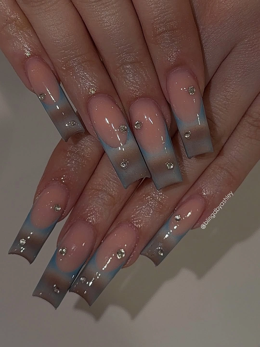 Soft pink almond nails with cream taupe and minimal detail