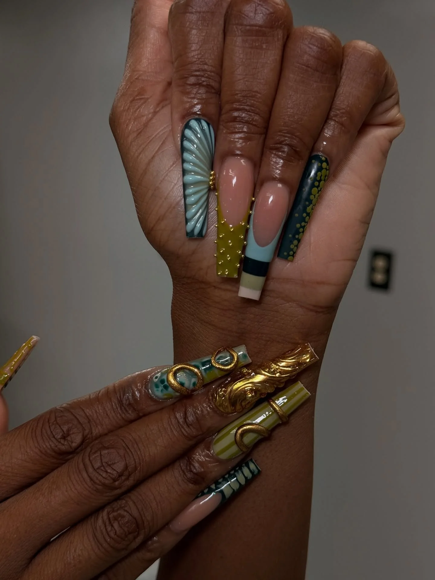 Teal olive square nails with gold charms and abstract fall blocks