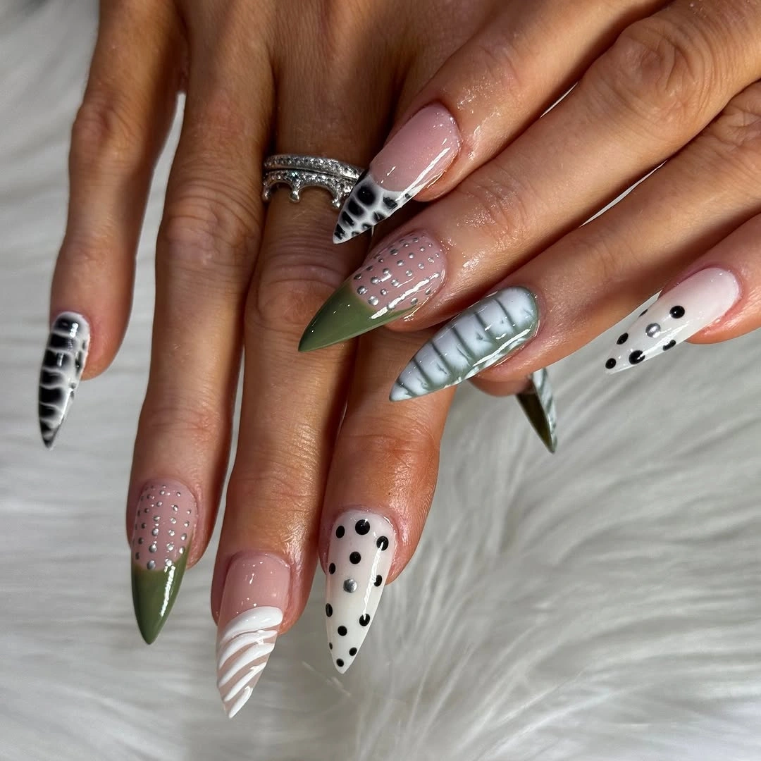 Long mixed nails with black dots white stripes green pink and silver accents