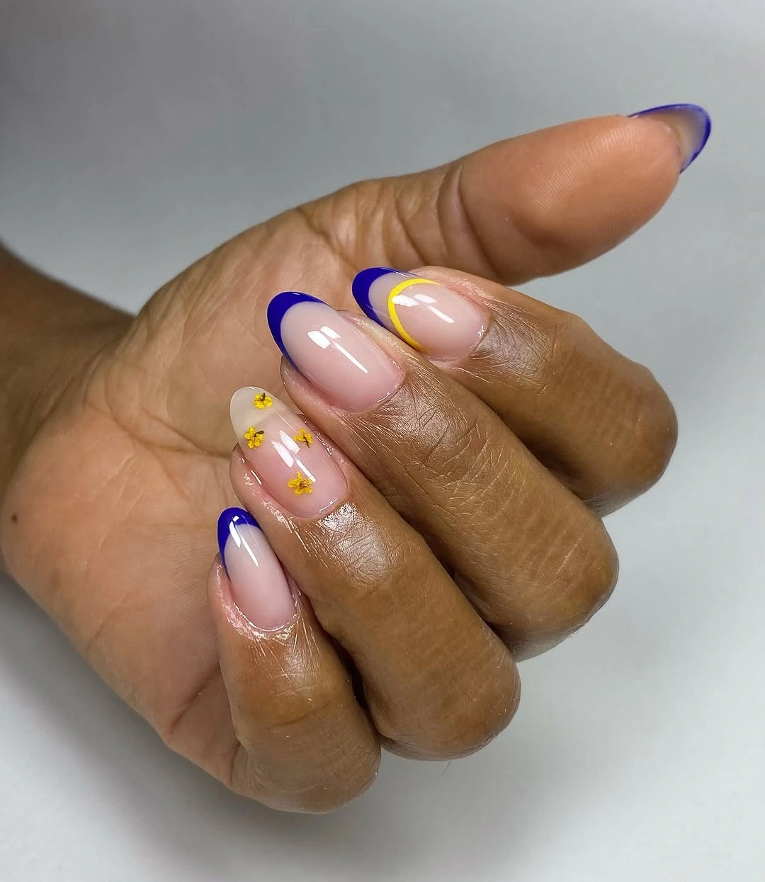 Short almond lavender French fall nails with yellow dots
