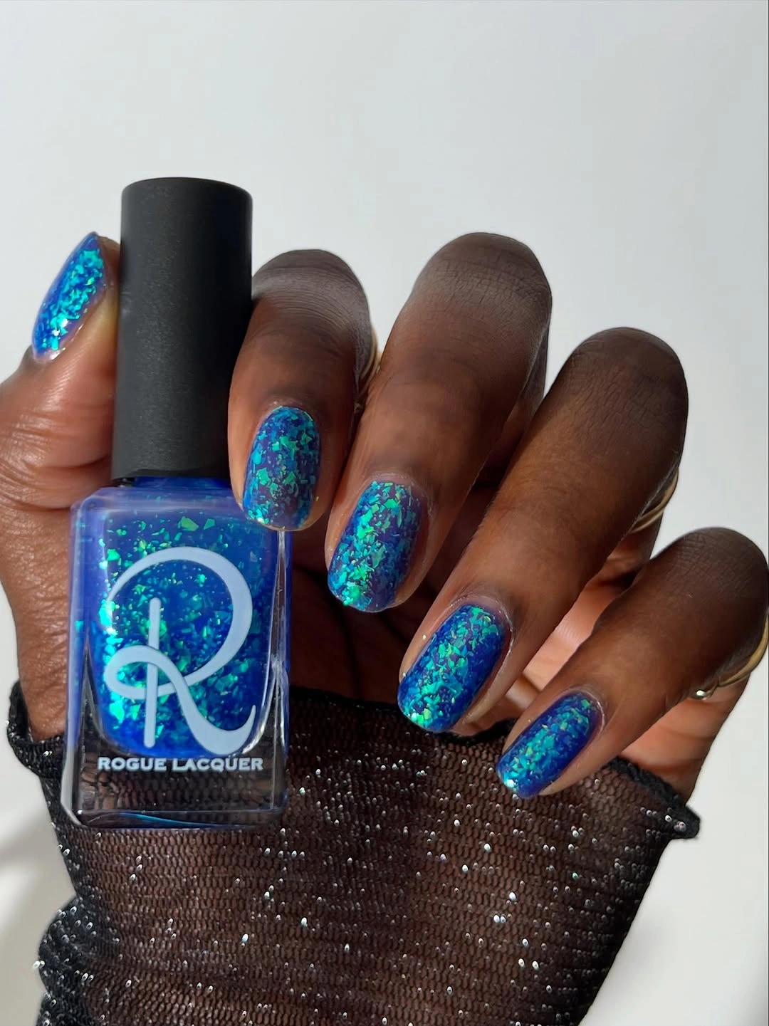 Long almond electric blue sparkle fall nails on dark skin