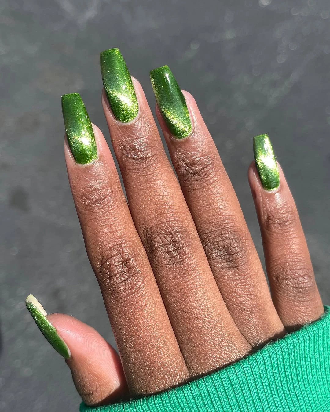 Medium almond green chrome fall nails on dark skin
