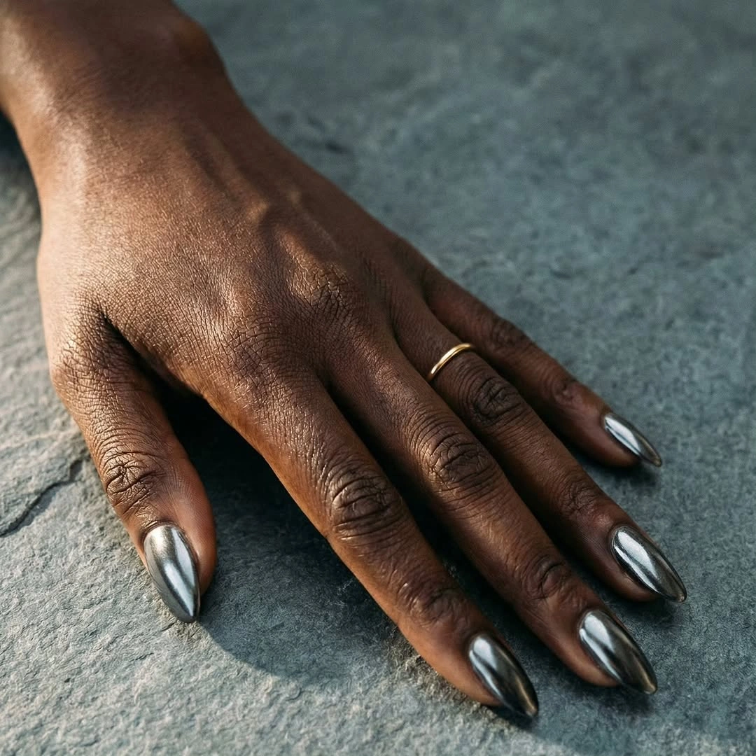 Medium almond silver chrome fall nails on dark skin
