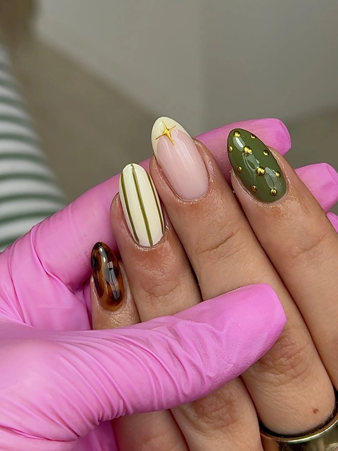 Mixed olive cream and tortoise almond nails with gold details