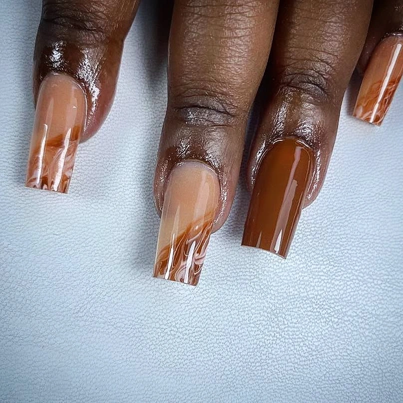 Translucent caramel French blocks on medium square nails