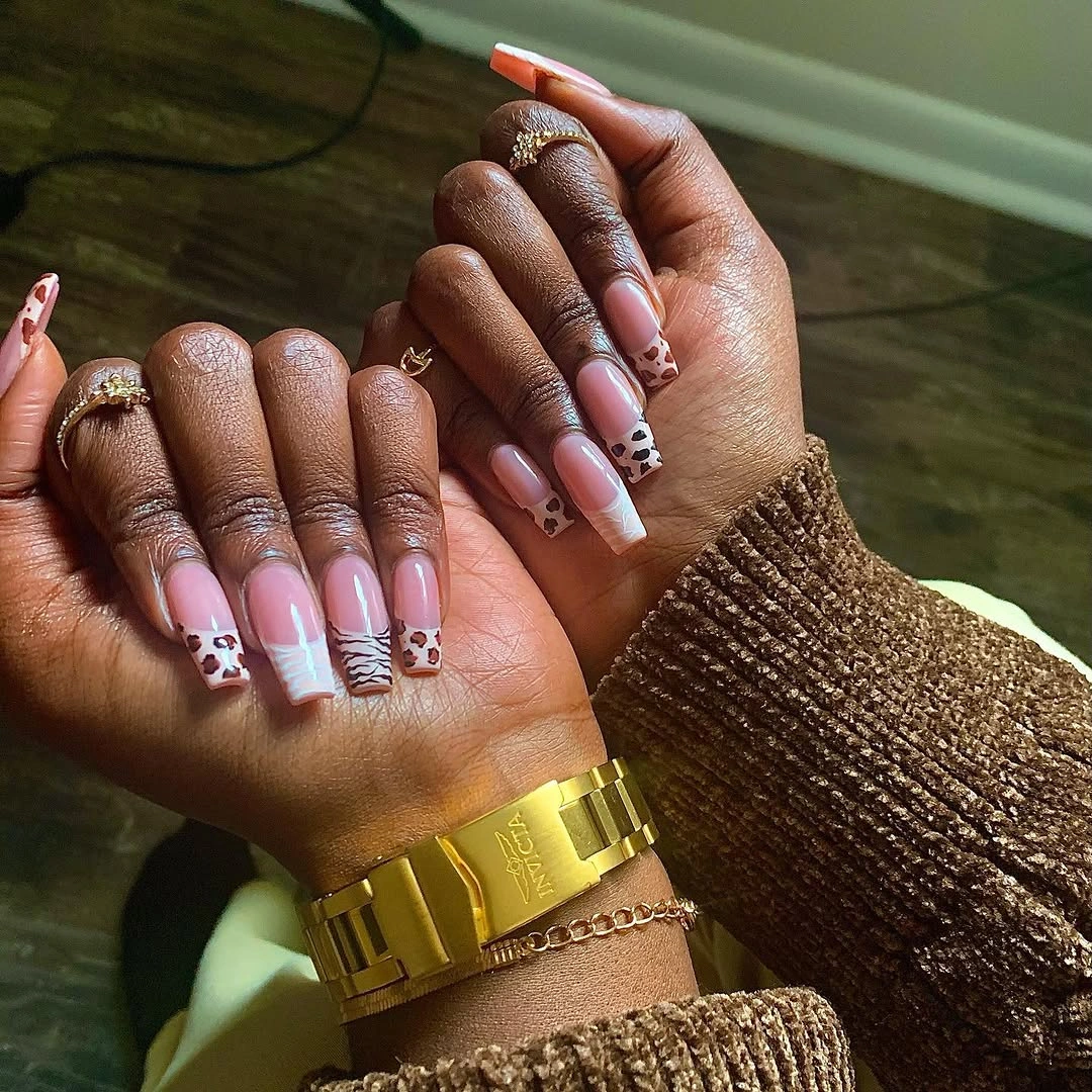 Pink terracotta almond nails with striped French tips