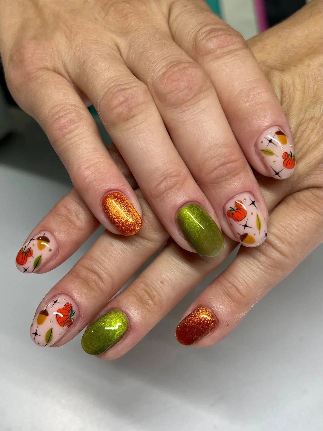 Mixed orange olive glitter and floral autumn nails