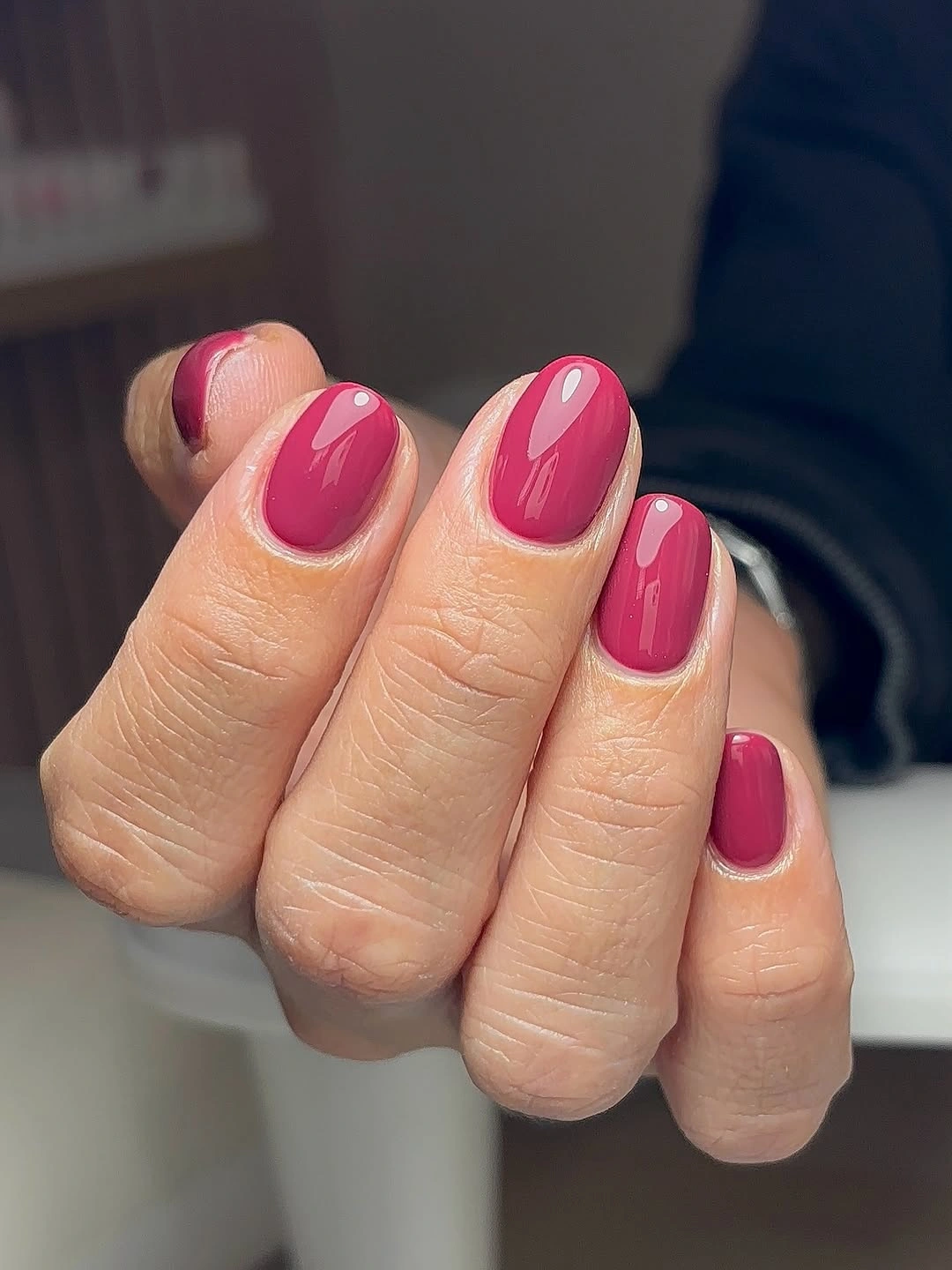 Medium rounded raspberry pink nails with glossy finish