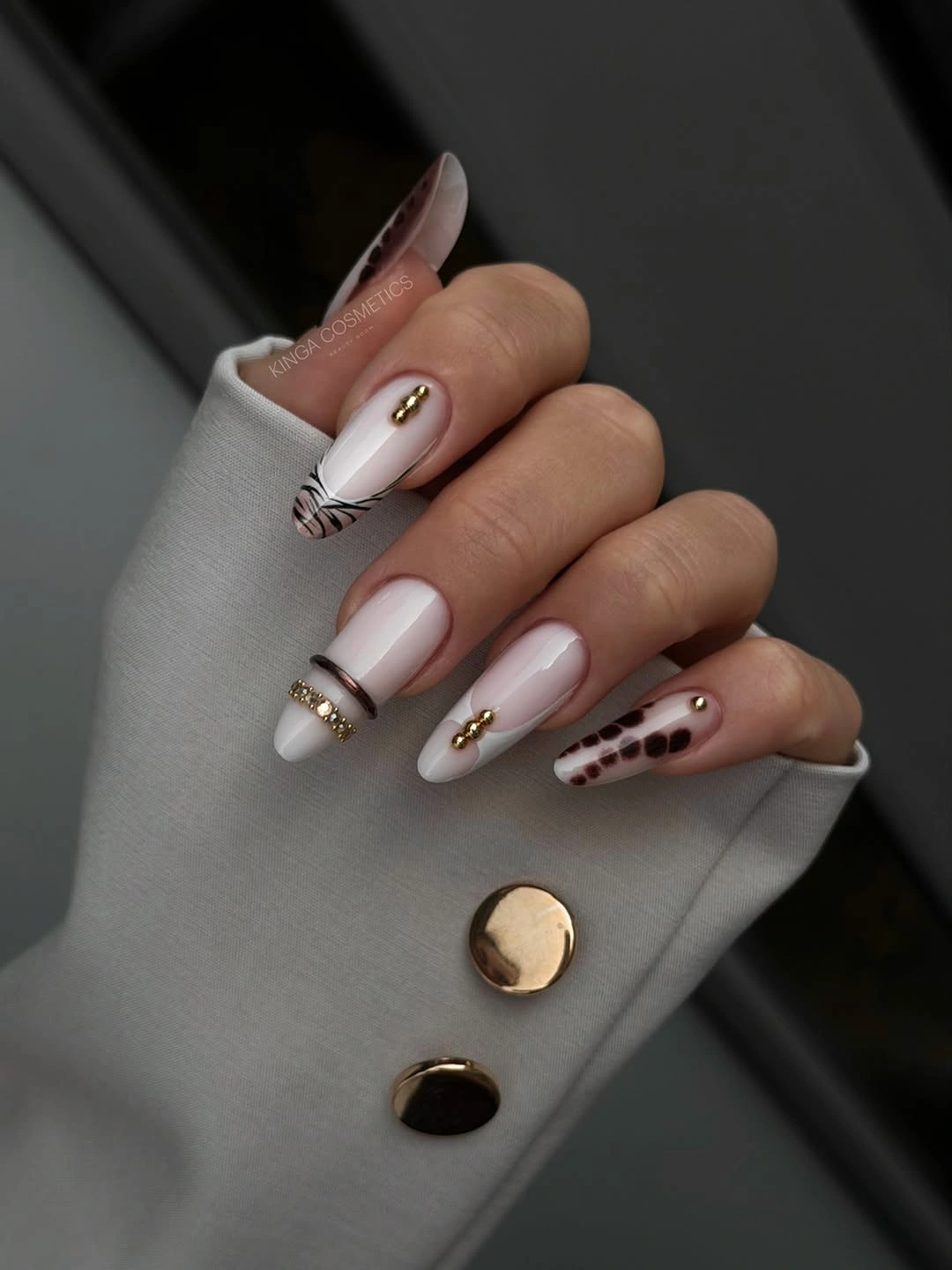 White brown pink almond nails with leopard patterned accent