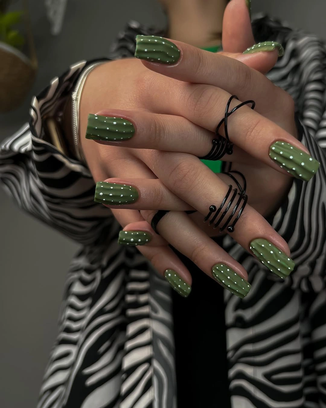 Olive square nails with pale tonal green textured accents
