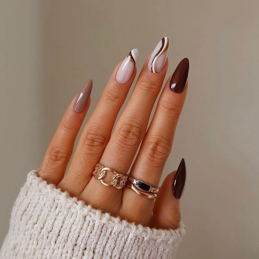 Long almond nails with ivory centers and burgundy curved panels