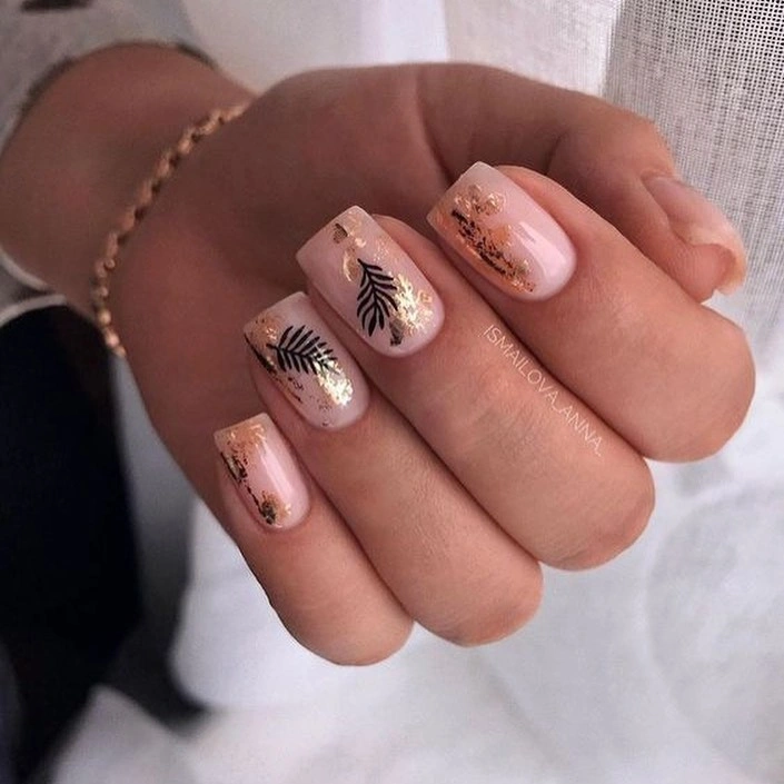 Short pale nails with tiny black linework accents
