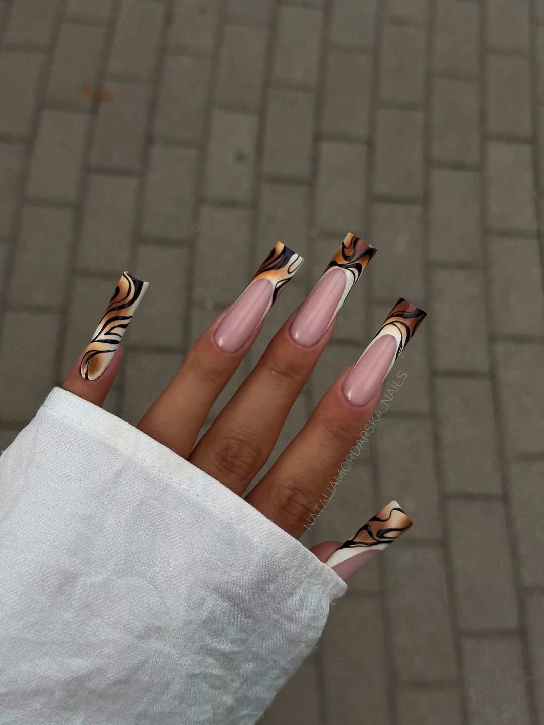 Long square nude nails with black brown cream line art