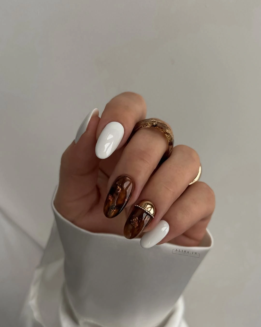 Almond cream espresso brown nails with amber patterned accents