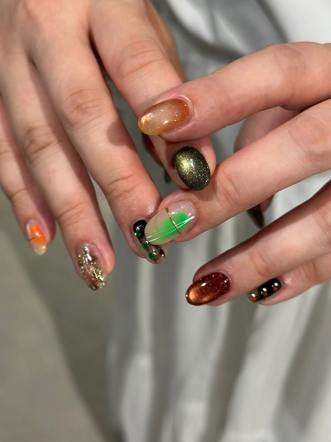 Orange green red and gold textured autumn nail accents
