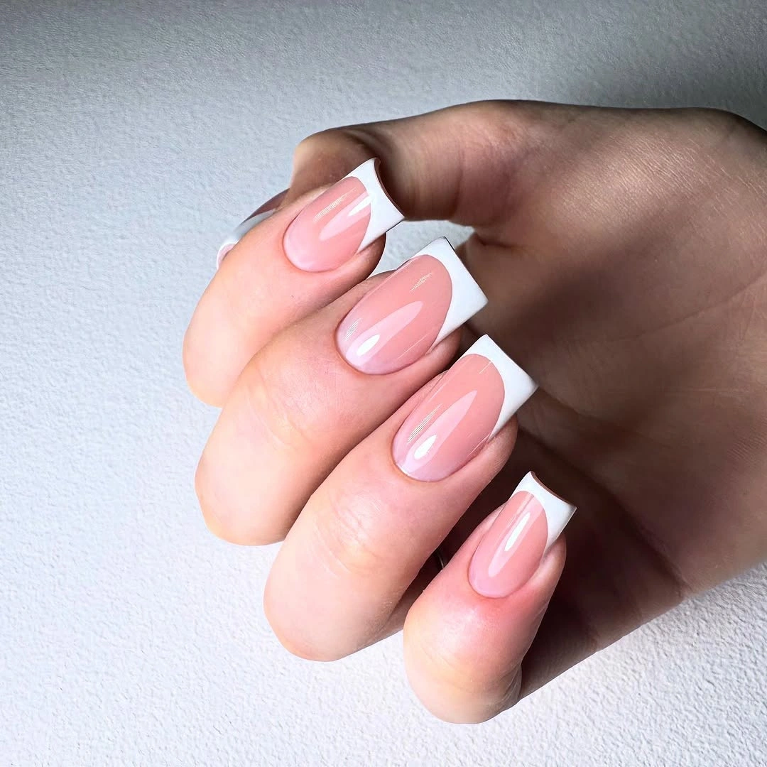 Blush squoval nails with substantial white French tips