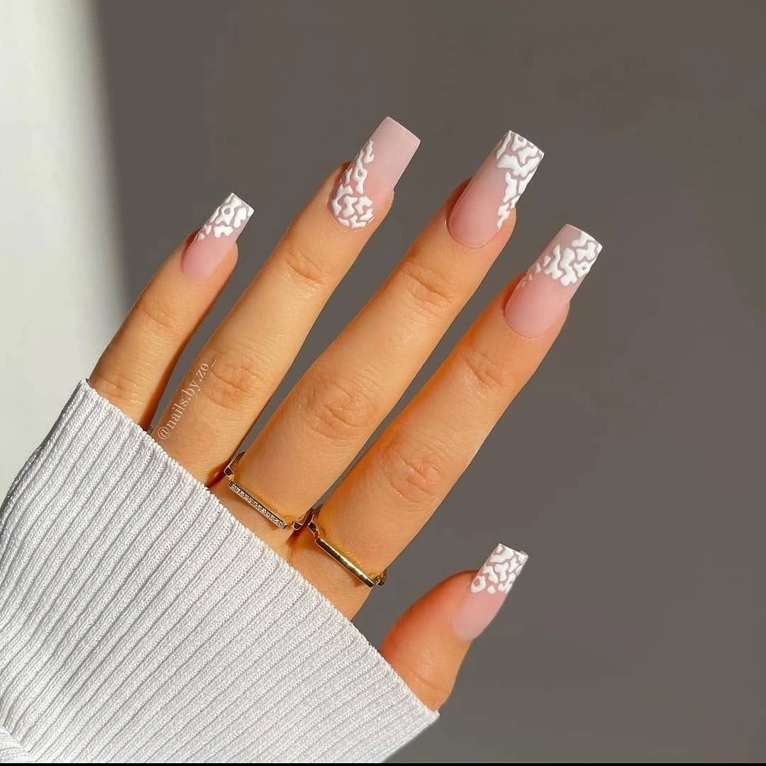 Long nude square nails with white lace-like tips