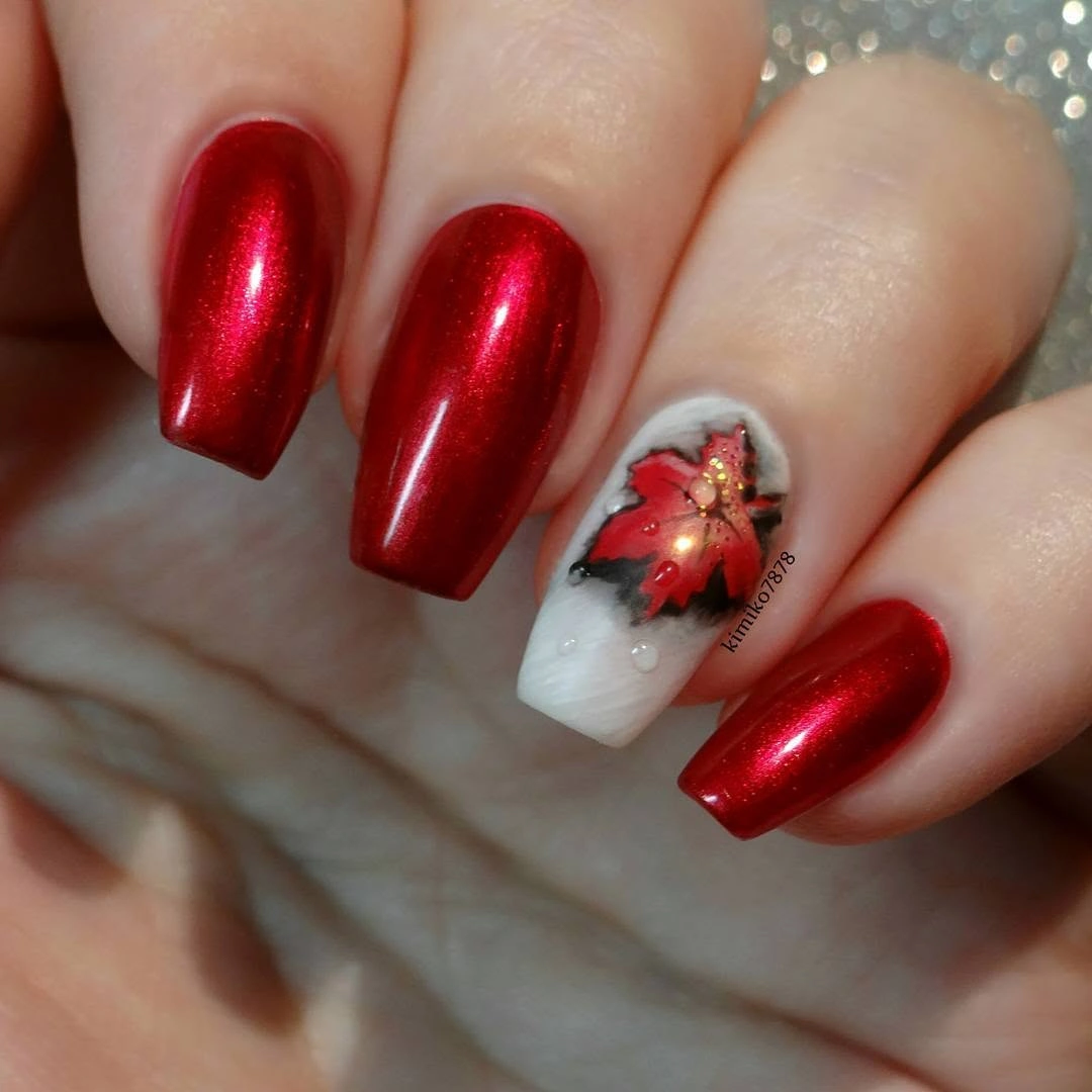 Reflective red square nails with one white seasonal accent