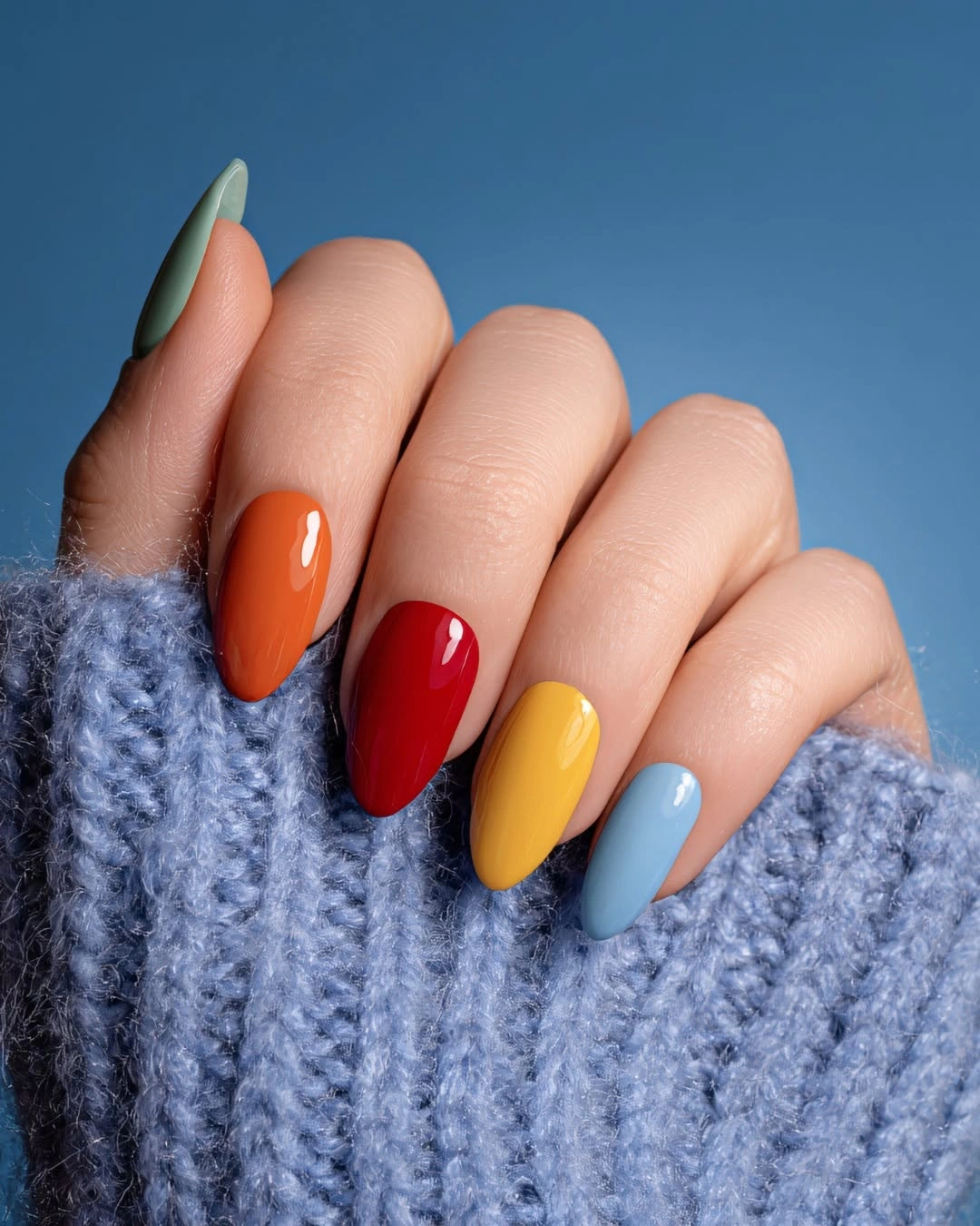 Medium almond nails in orange red yellow blue and green