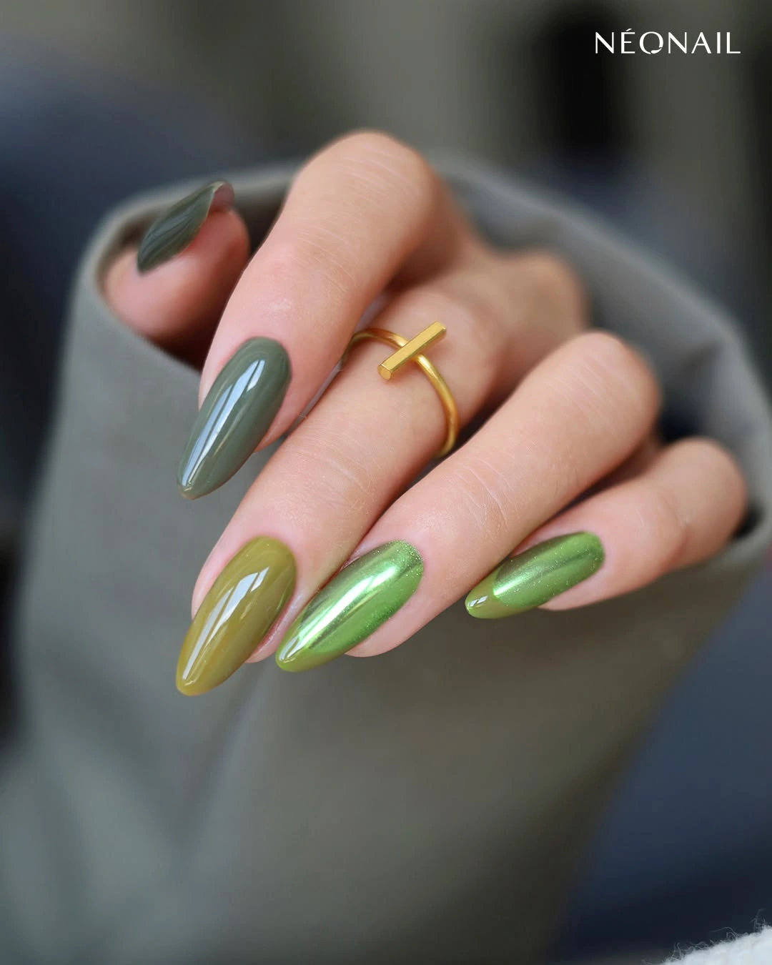 Long olive almond nails with glossy green tonal reflections