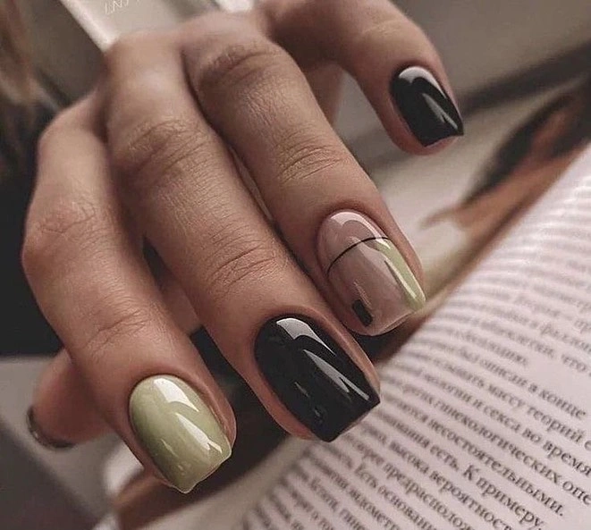 Short black and olive nails with one transparent outlined accent
