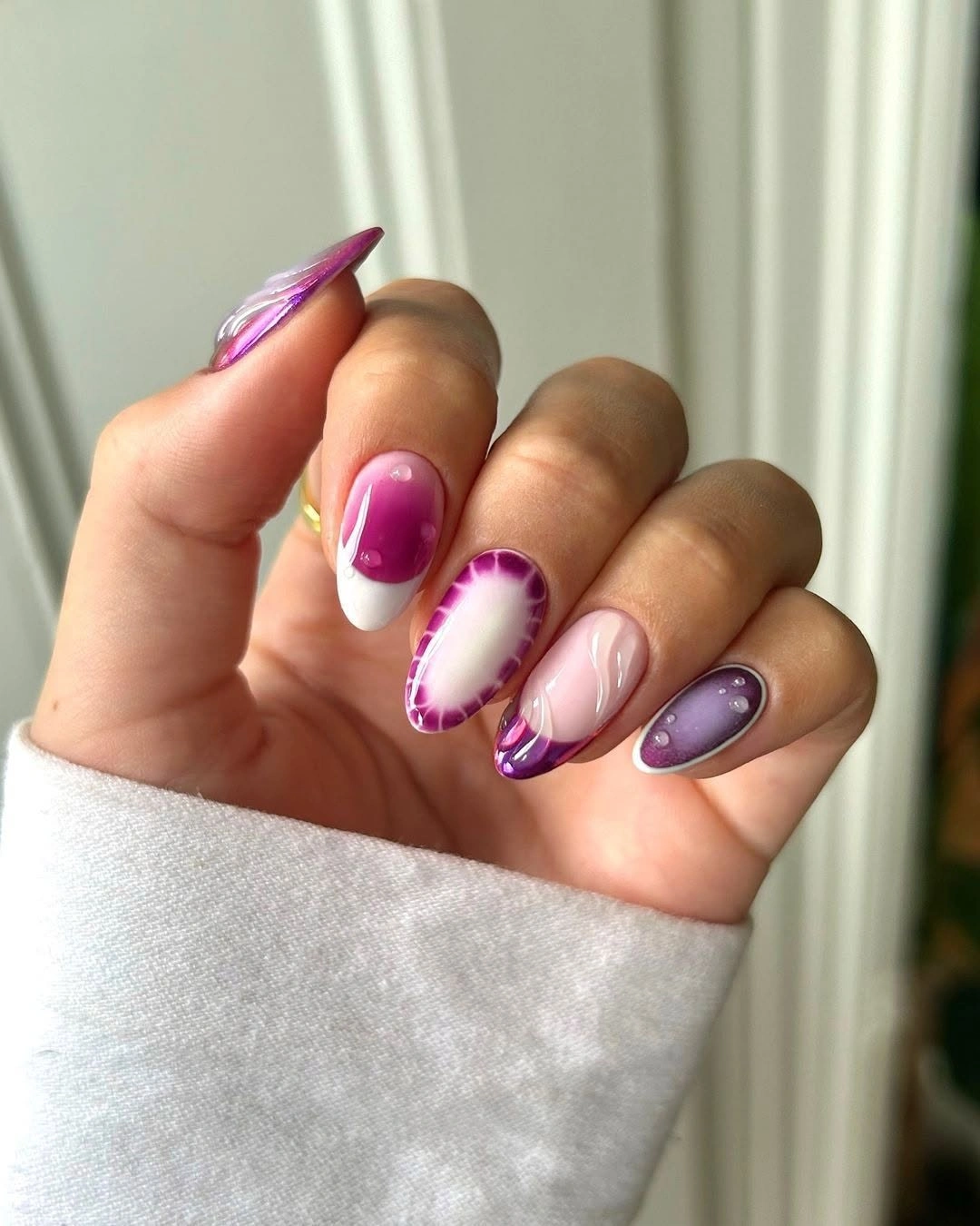 Long pale square nails with black botanical print and yellow accents