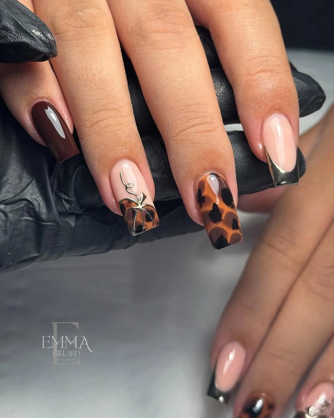 Long almond nails with tortoise orange panels and dark accents