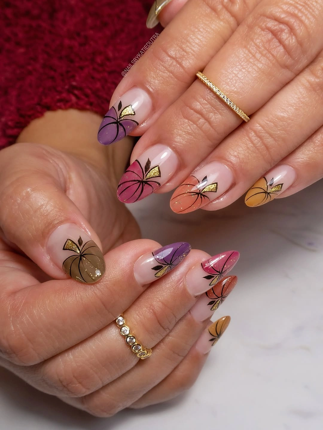 Almond nails with multicolor autumn leaf and pumpkin accents