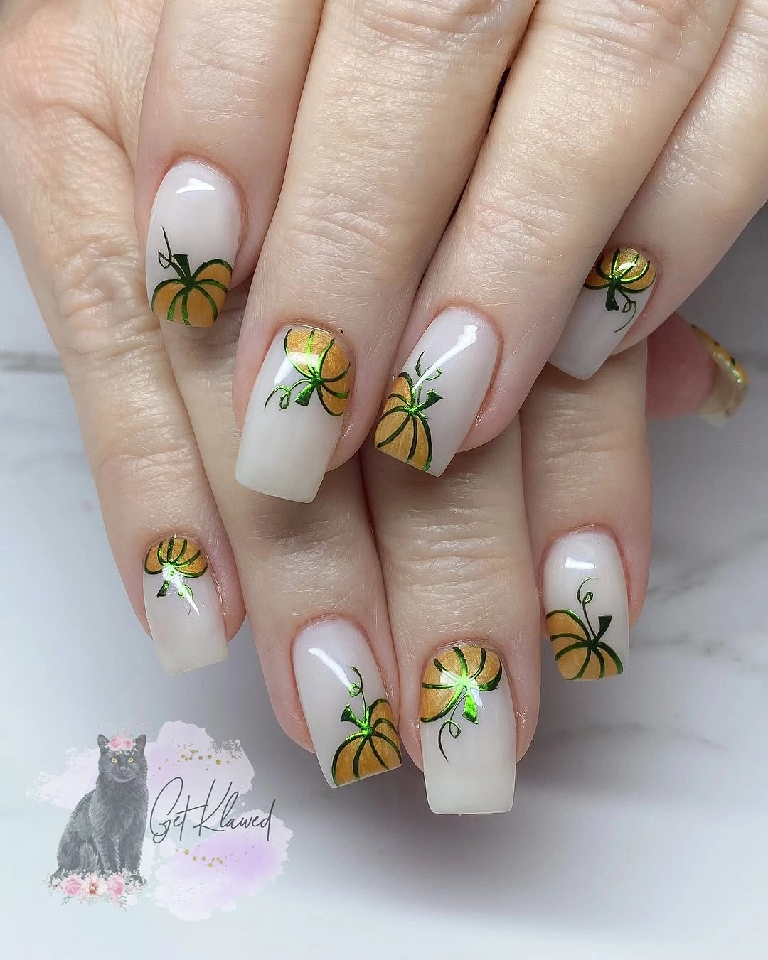 Milky square nails with repeated green pumpkin stems