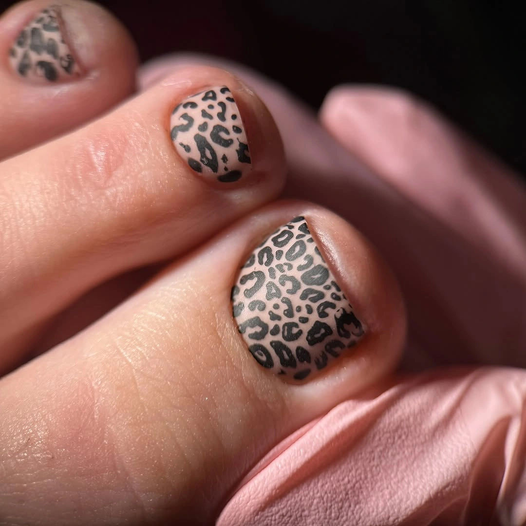 Nude toenails with black leopard like spots