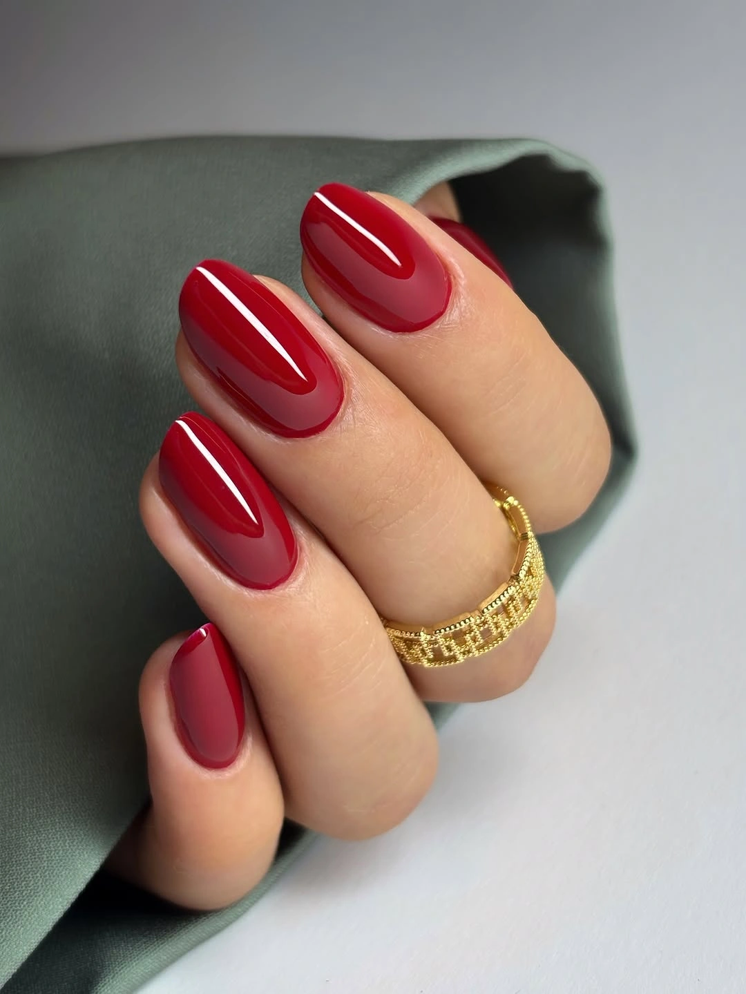 Rounded glossy deep red nails