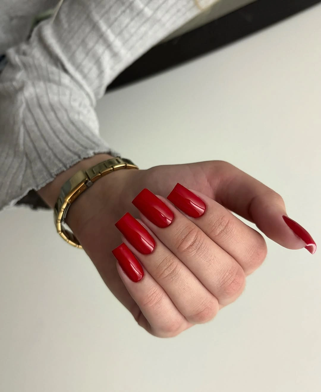 Medium long square nails in glossy bright red