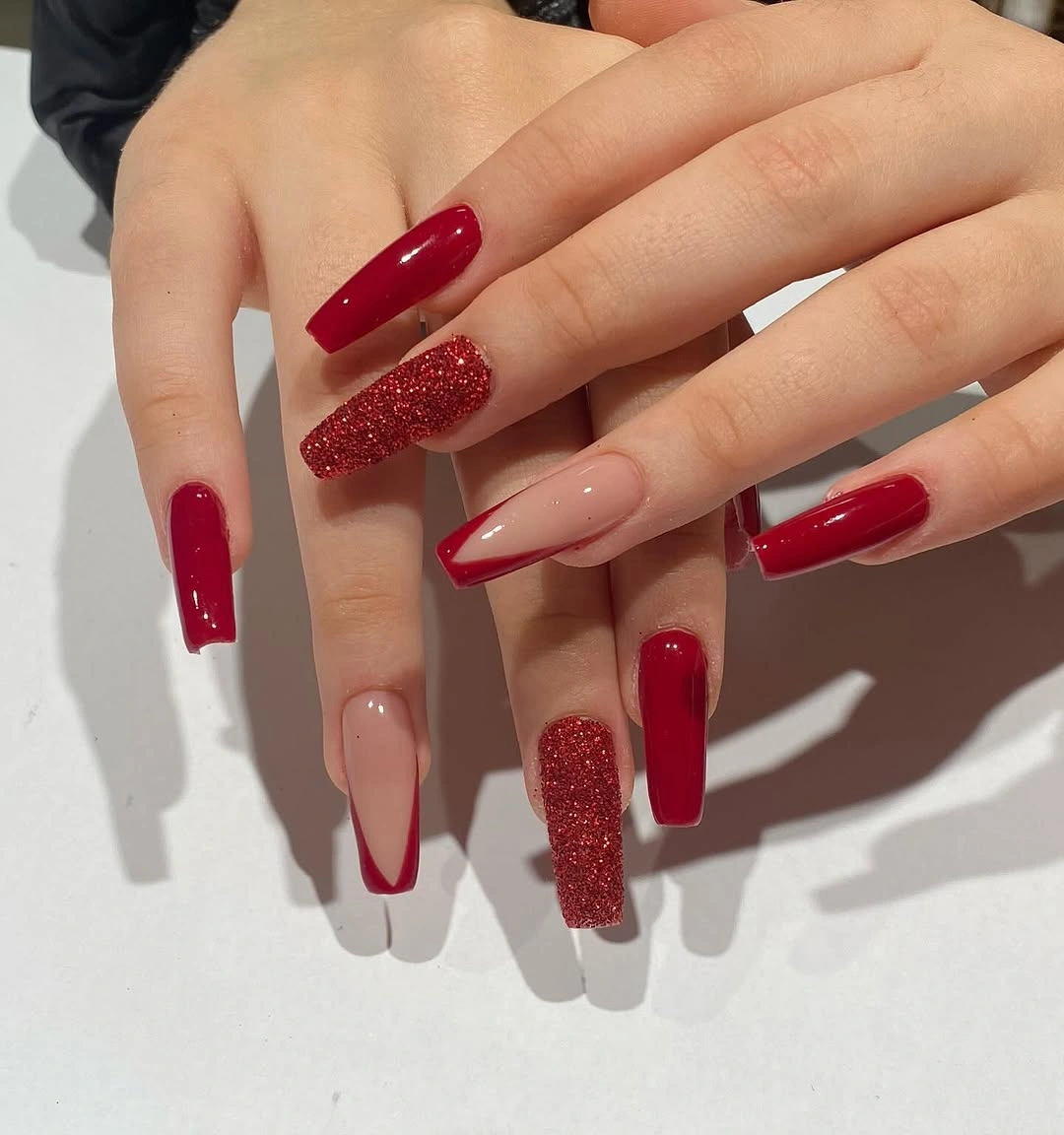 Deep red square nails with sparkle and nude accents