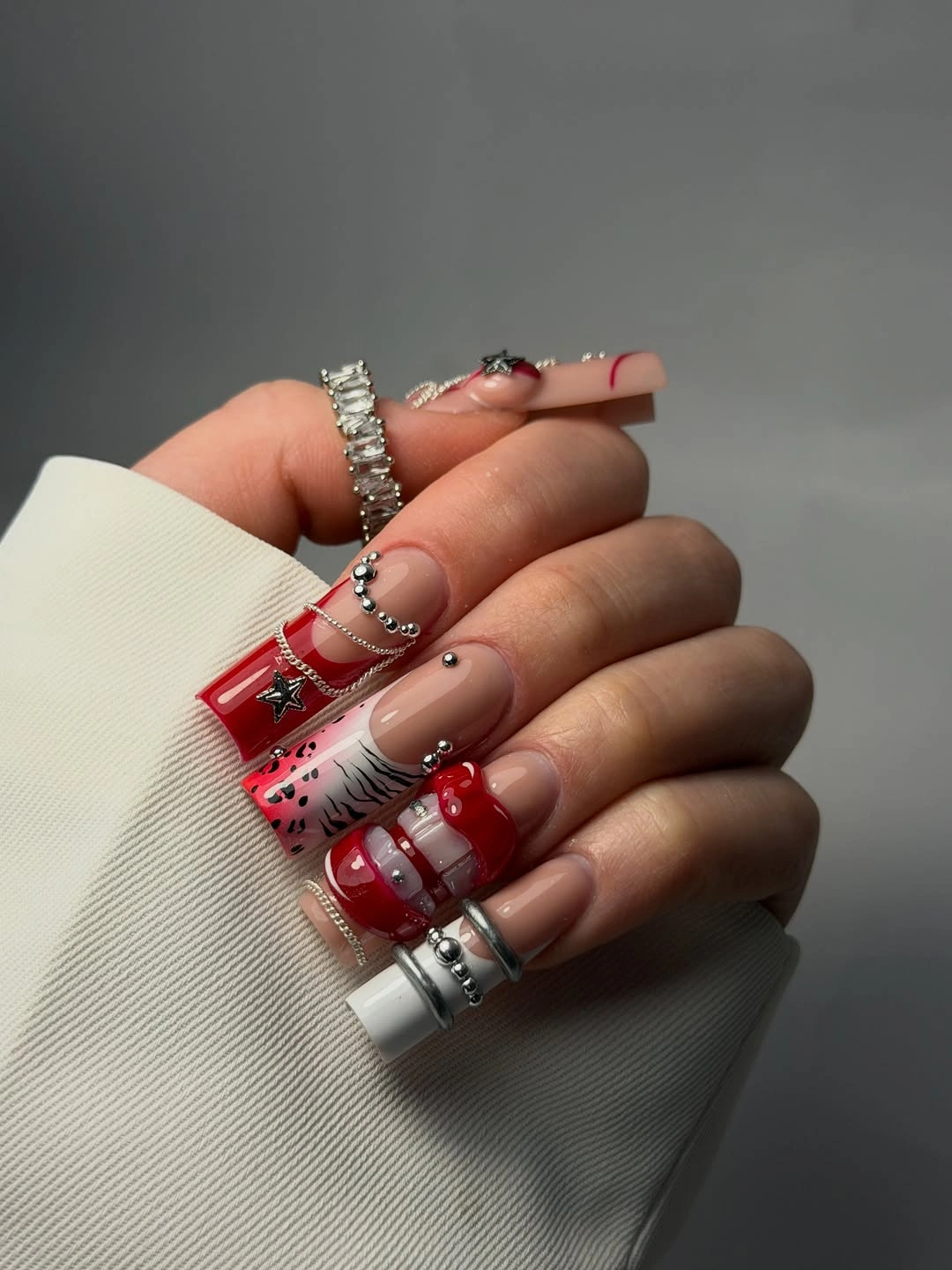 Maximalist red square nails with chains and stars
