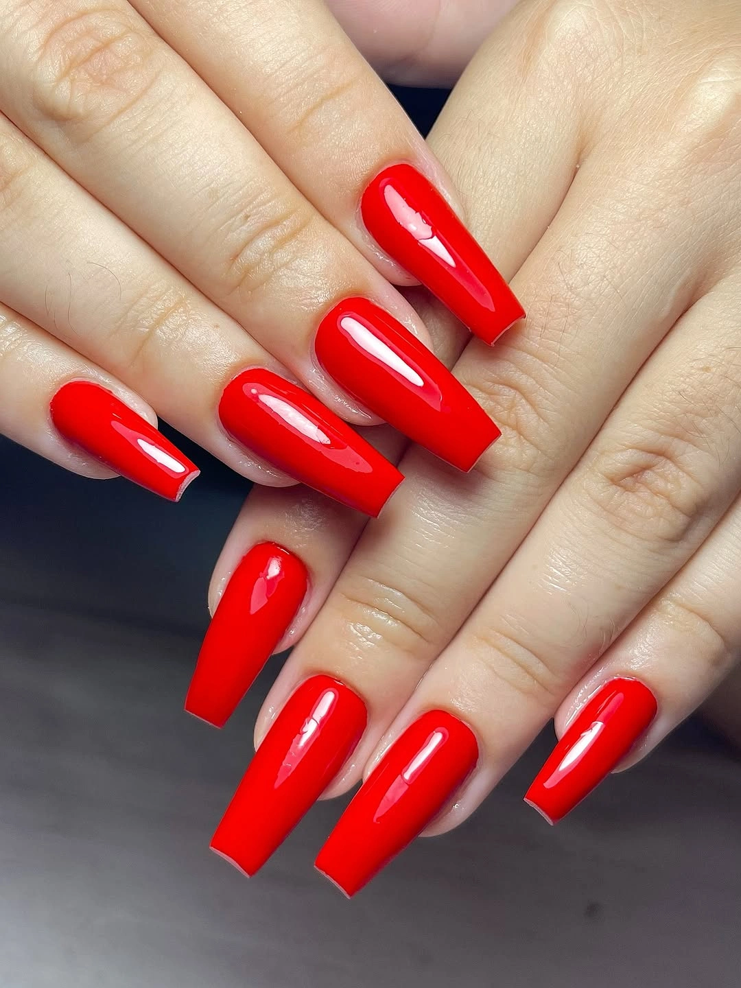 Glossy bright red tapered square nails