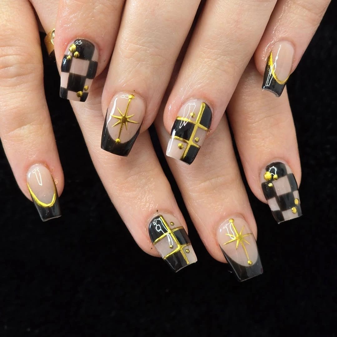 Short square nails with black yellow and checker graphics