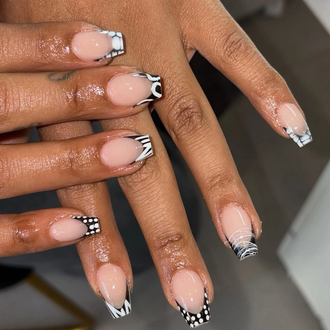 Medium nude nails with black white dots checks and lines