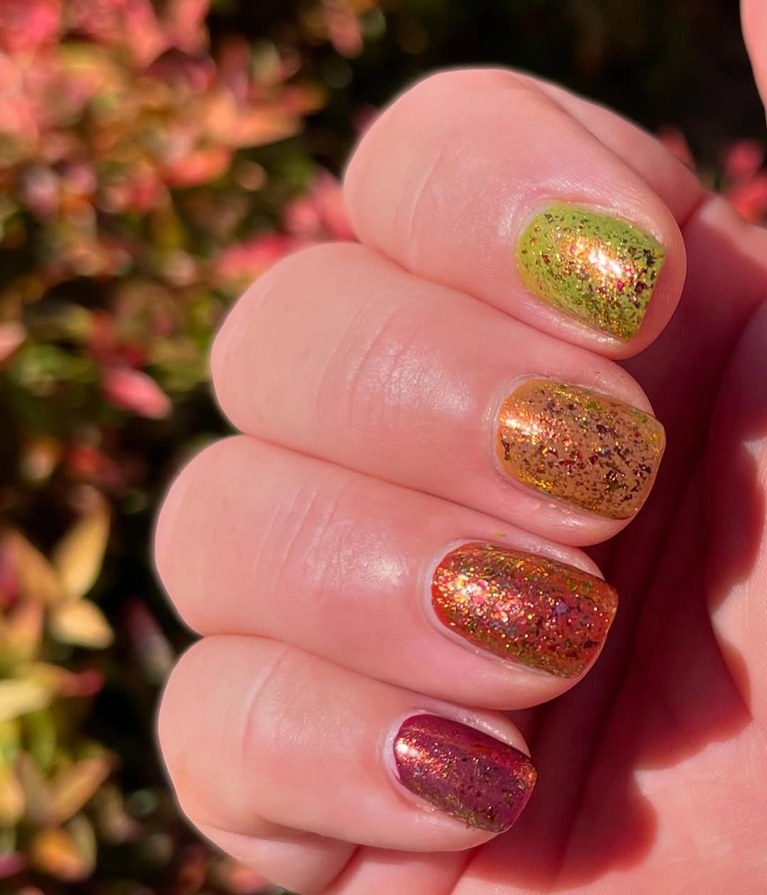 very short autumn glitter nails in green copper and berry