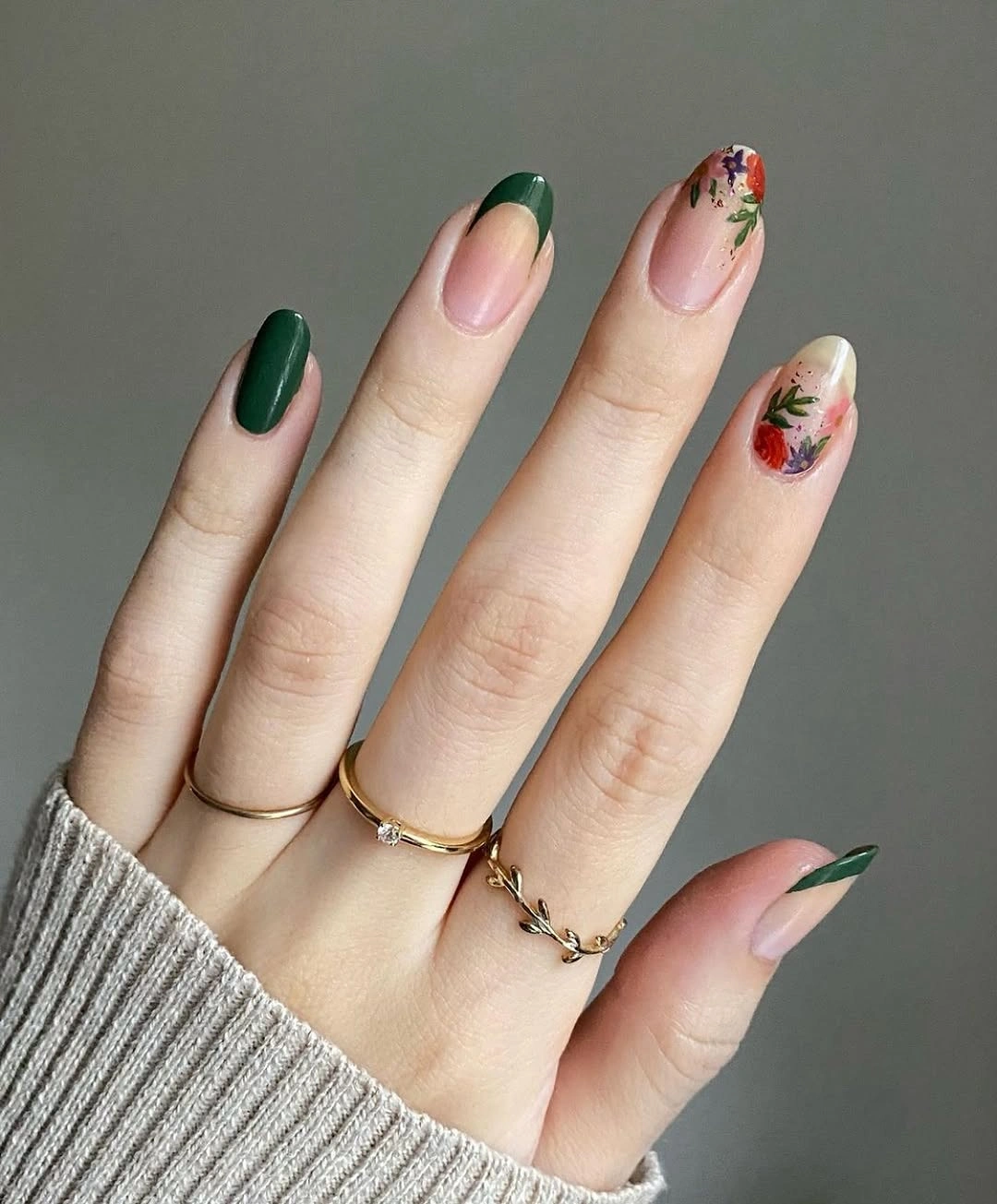 forest green almond nails with floral accent designs
