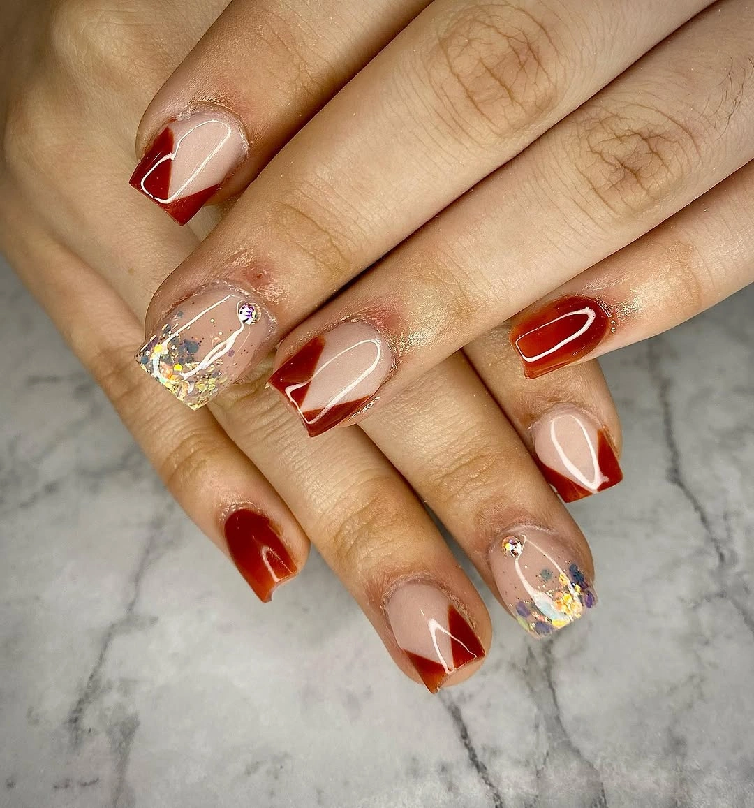 amber square nails with nude space and gold glitter