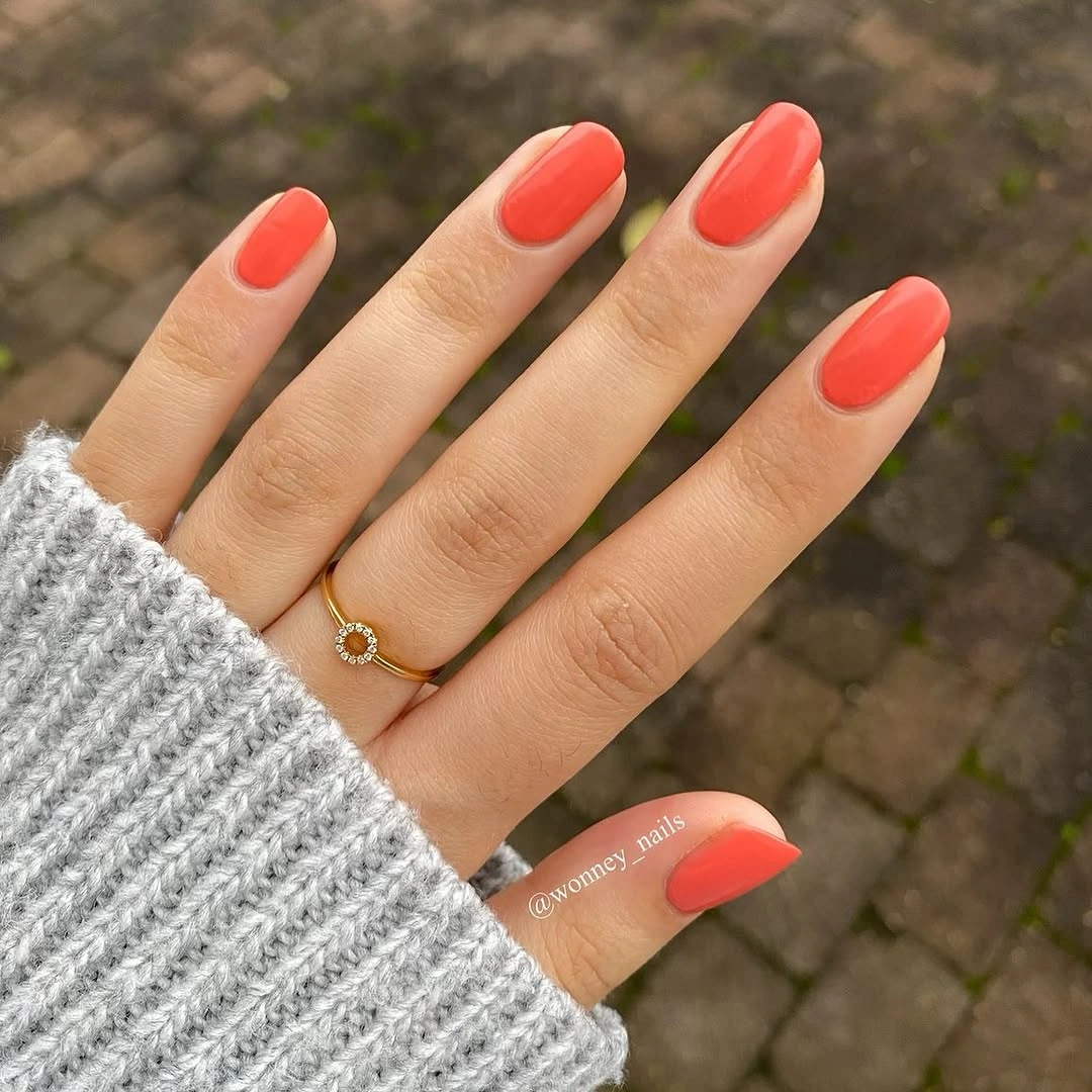 glossy coral short almond nails for early fall