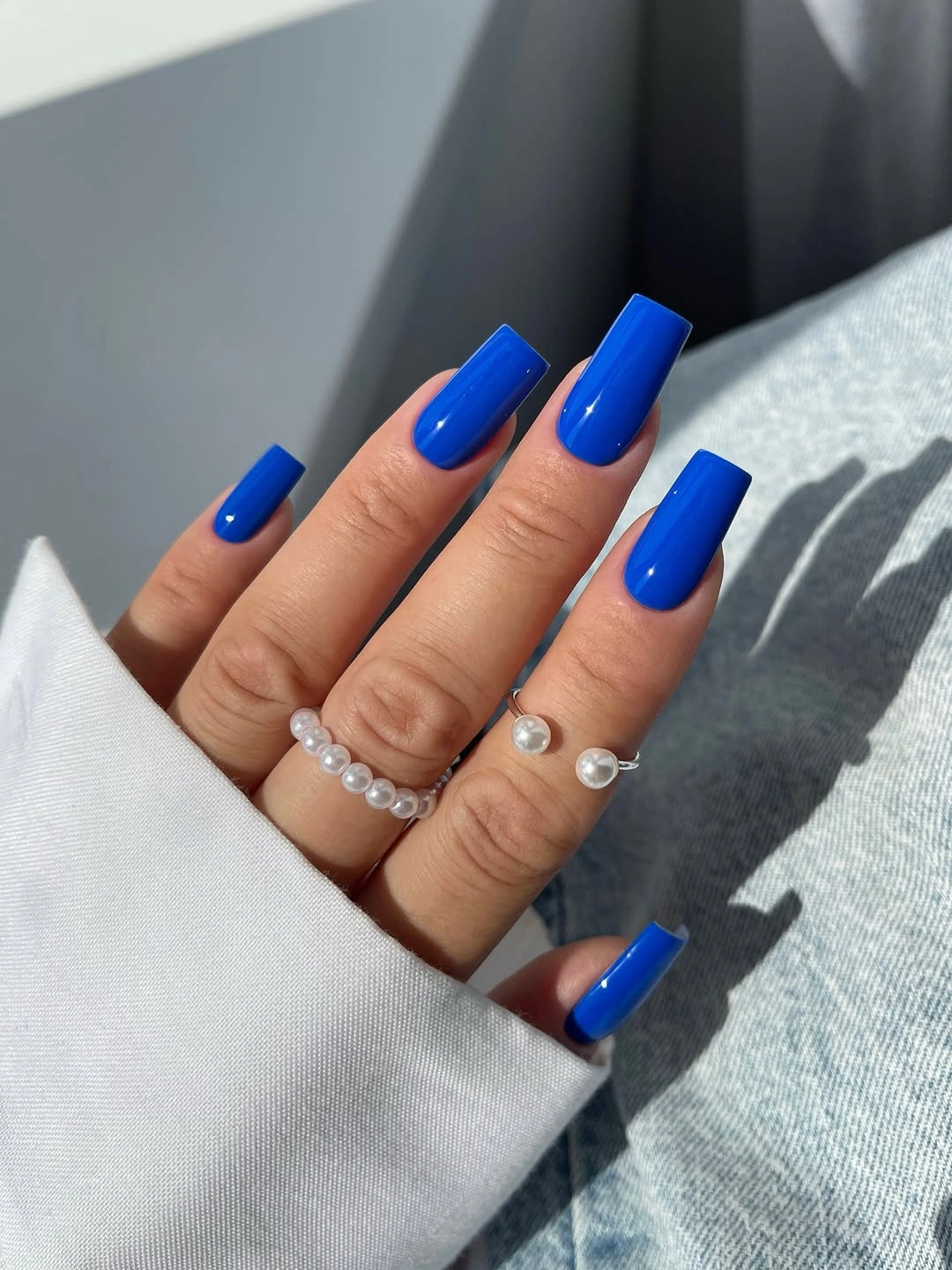 Long cobalt blue square nails in a uniform solid color