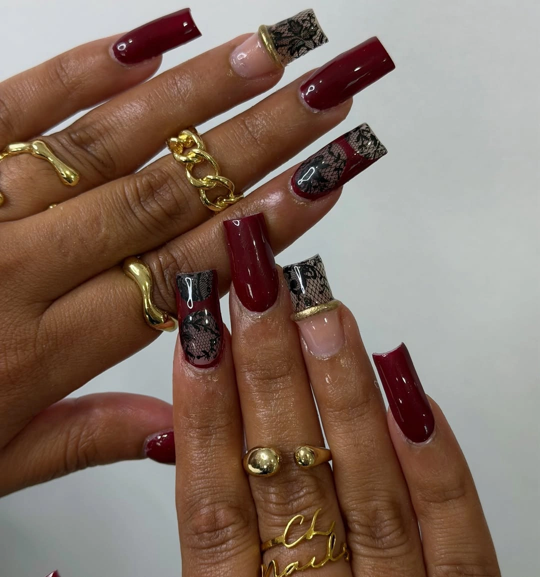 Long burgundy square nails with dark graphic accent nails
