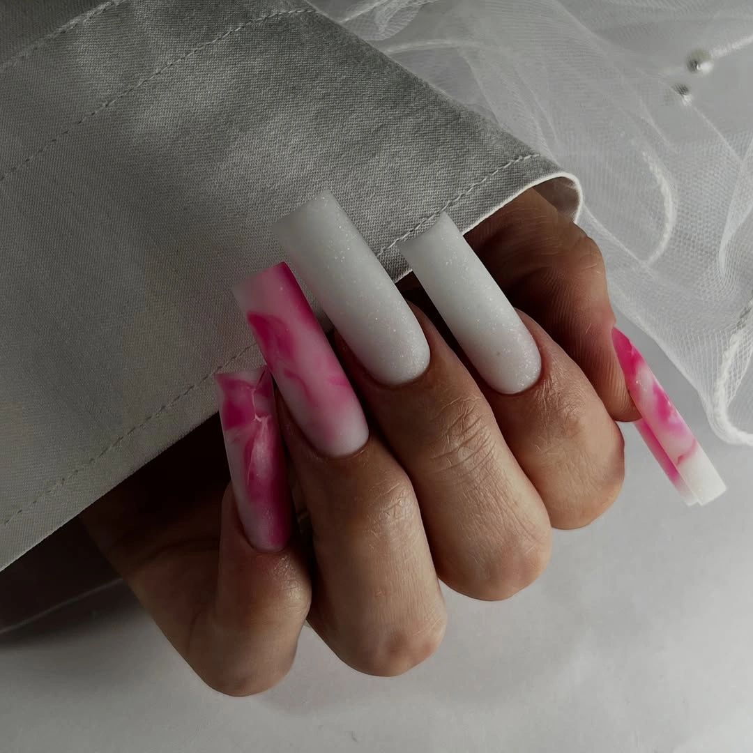 Long white and pale pink square nails with bright pink abstract art