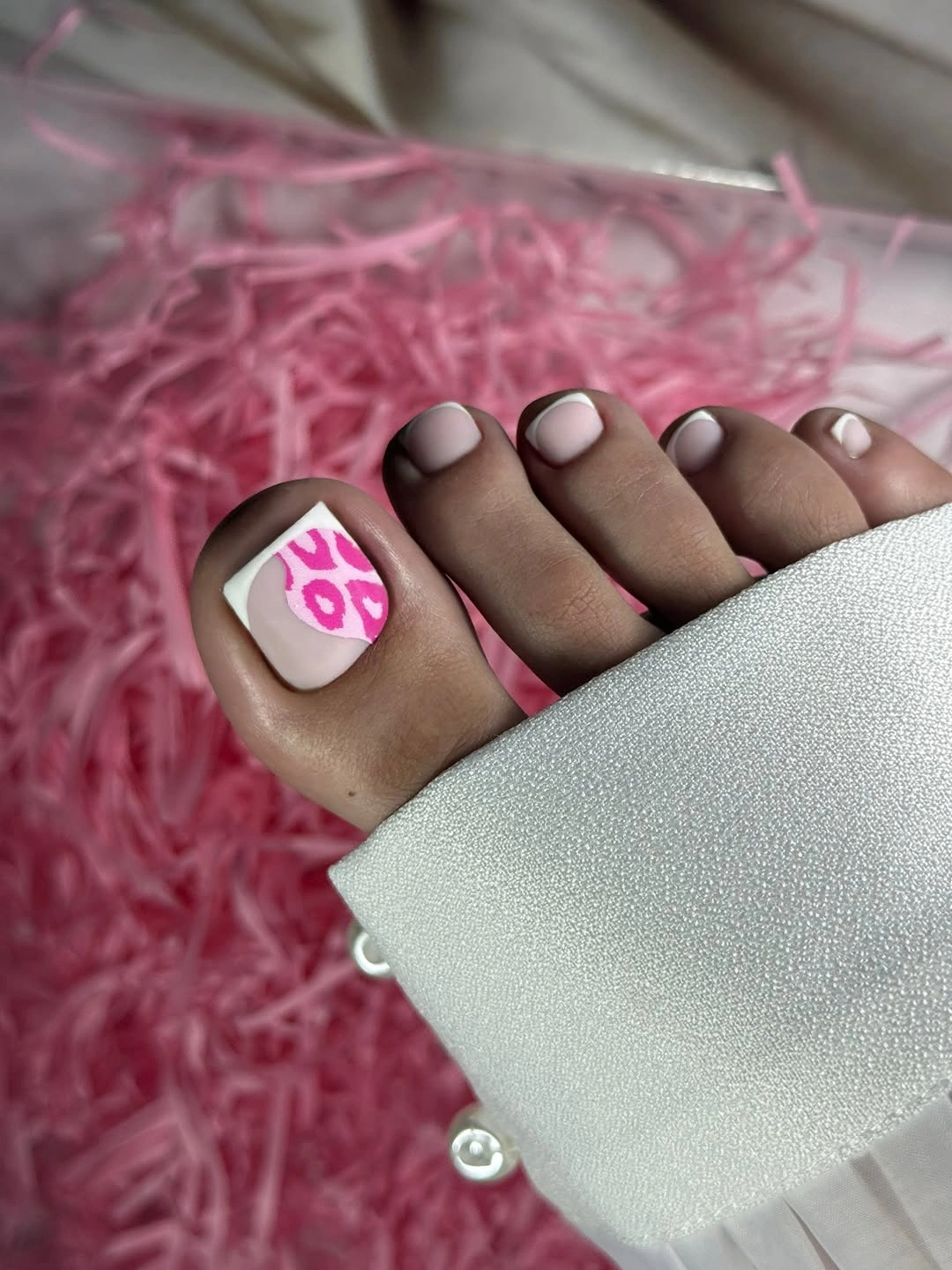 Pale pink toes with a bright pink and white big toe accent