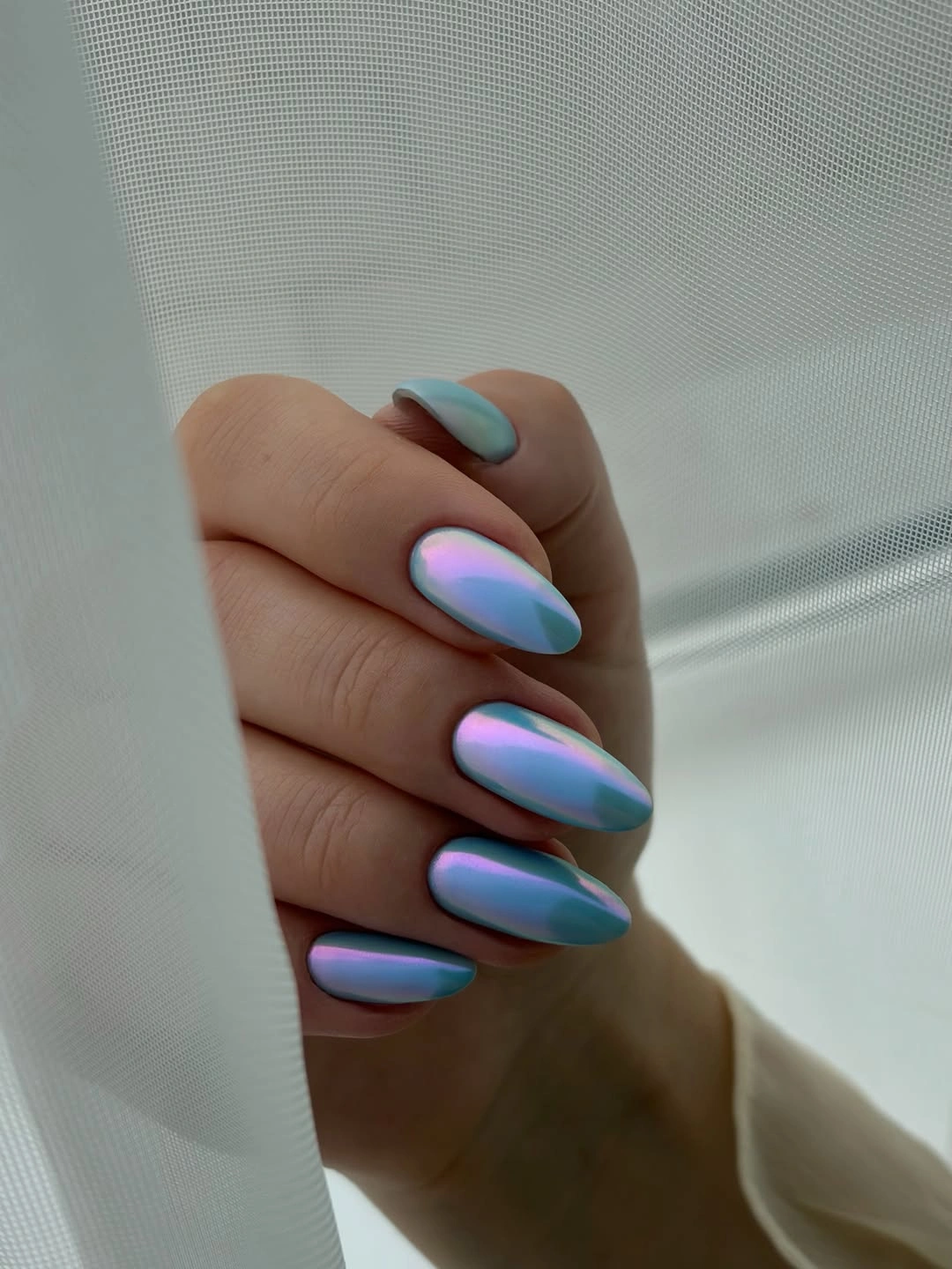 Long almond nails with icy blue lavender reflective finish