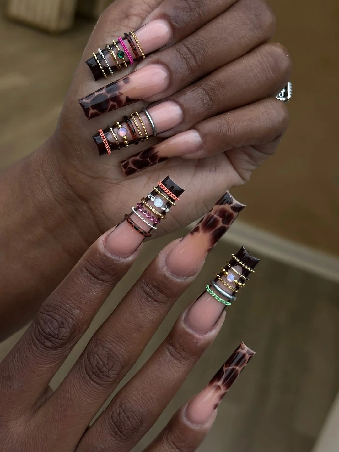 Long pink lilac coffin nails with layered chrome geometric details