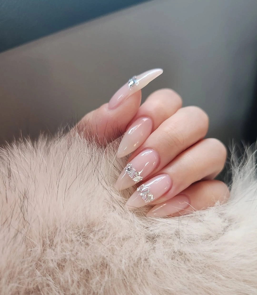 Blush almond wedding nails with white tips and delicate sparkle